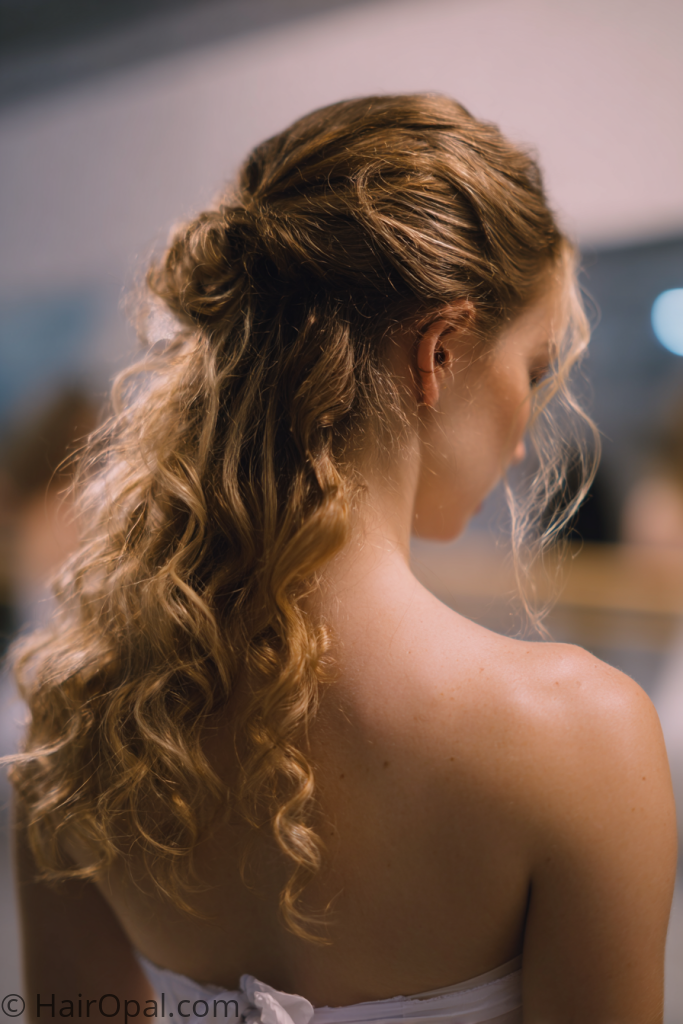 half up half down dance recital hairstyle with curled ends for long hair