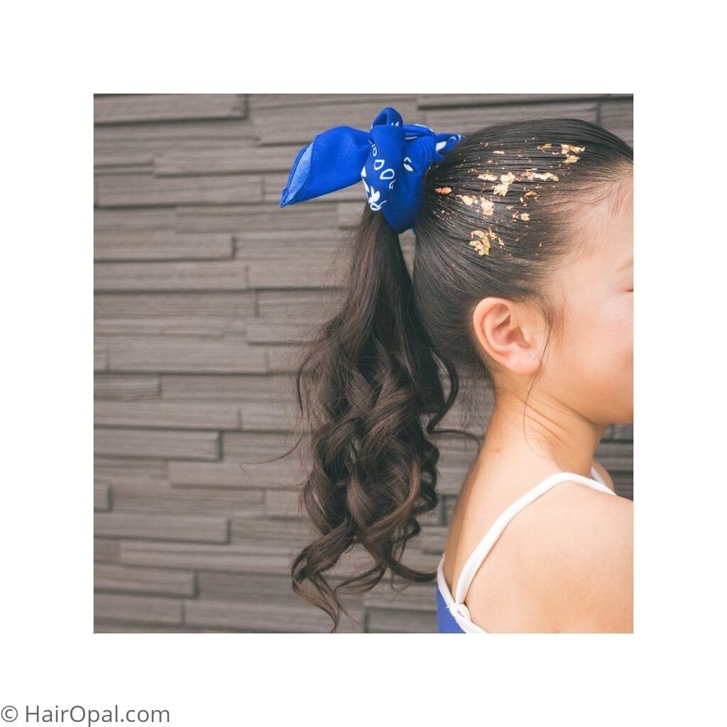 High ponytail styled with a bandana for an easy summer camp look