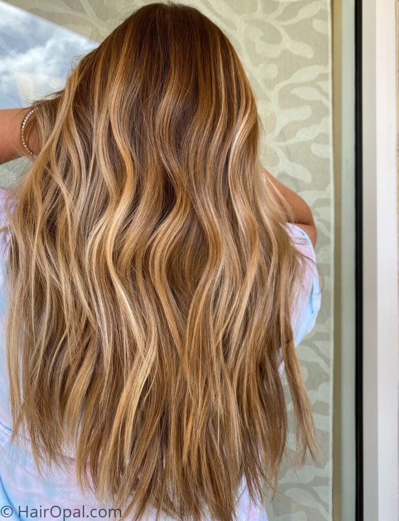 Woman with a short golden bronze hair cut and fall