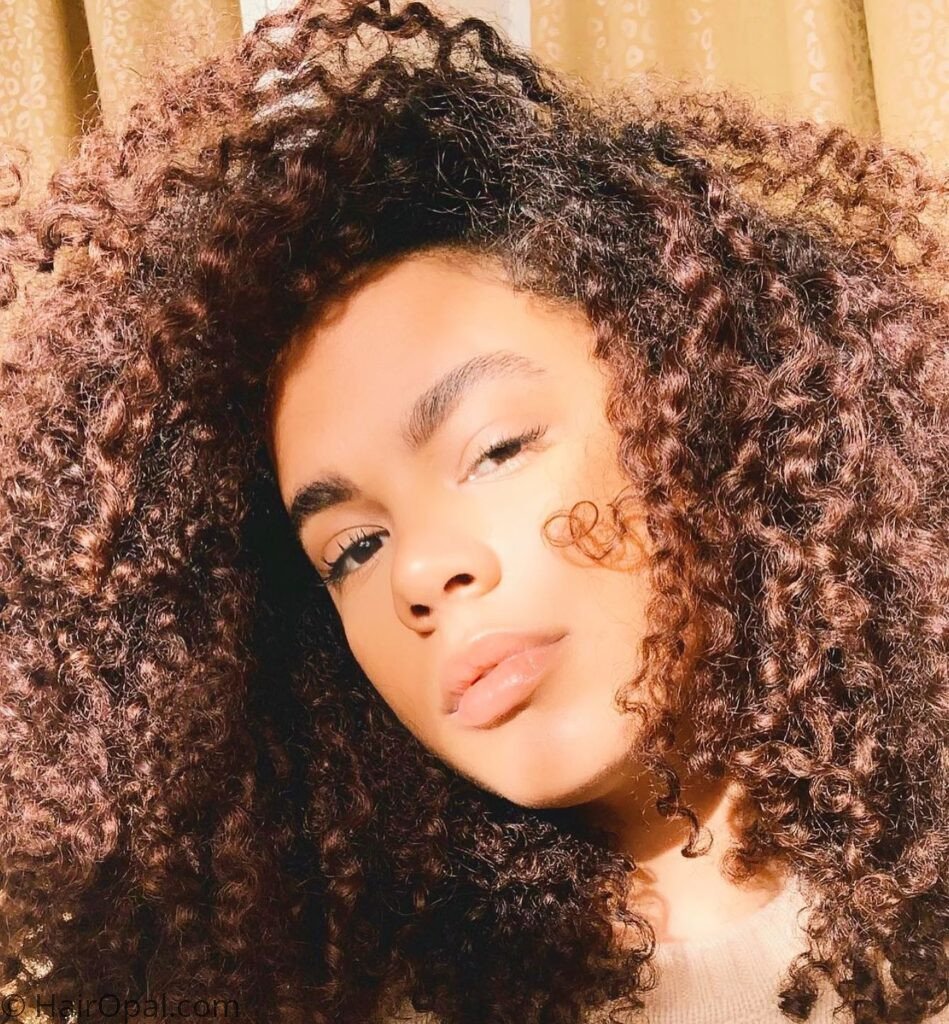 Black teen with short natural hair in a wash and go style for back to school